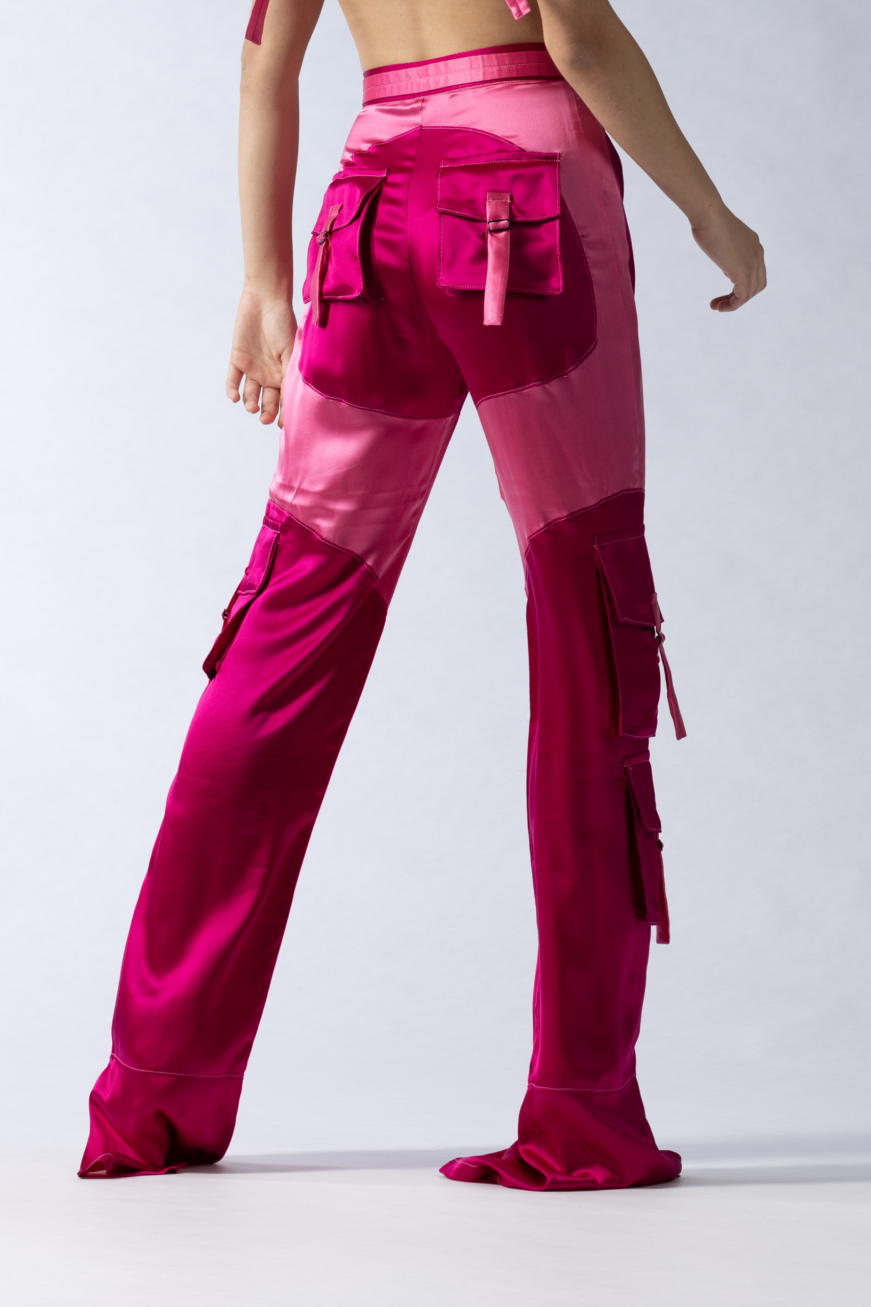 high end fashion editorial detail from behind of pink cargo trousers