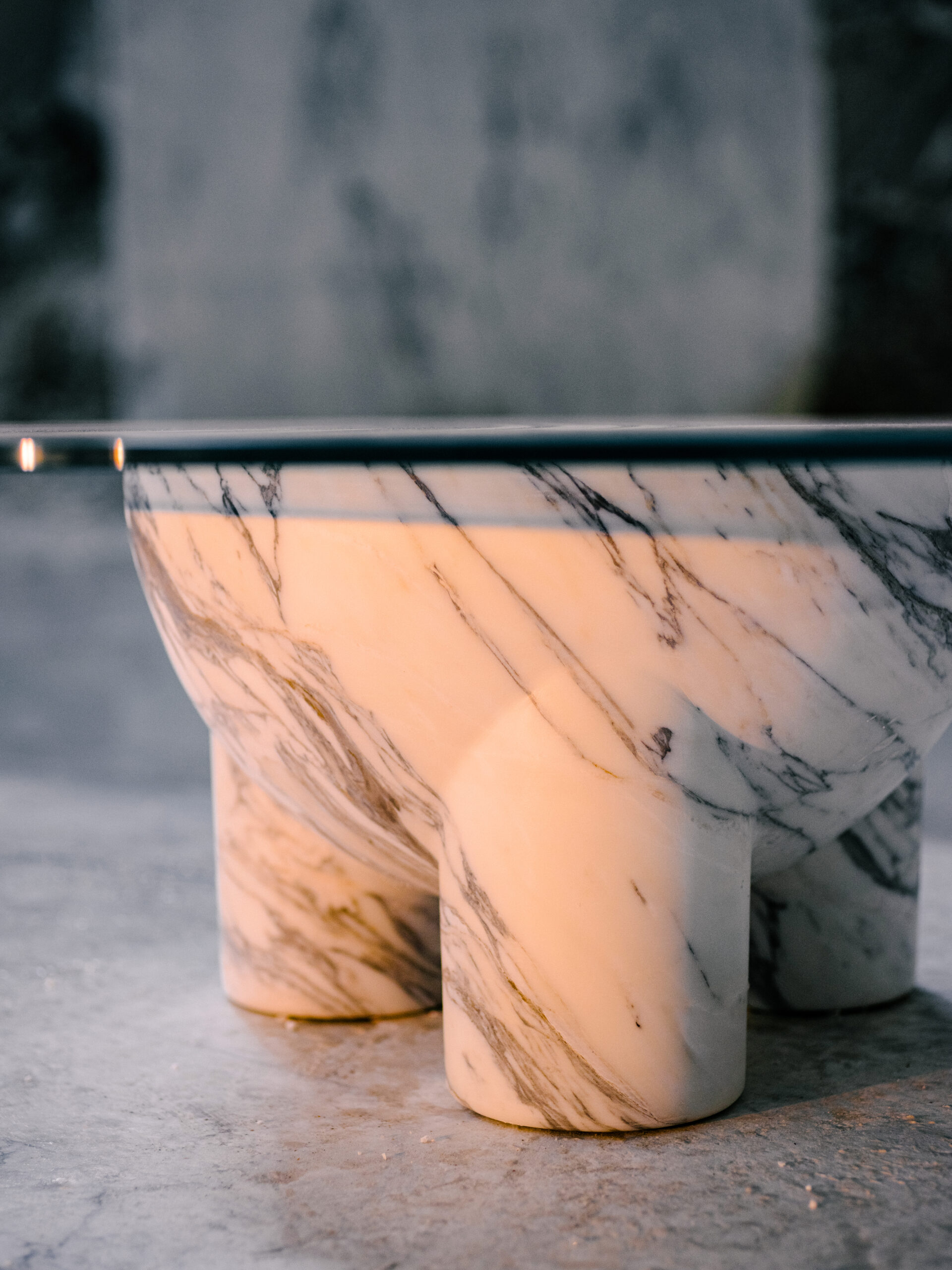 golden light detail of the marble tAAAble by BURGIO. in the Carrara quarry